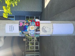 Yarn bombing at a secondary school in Coquitlam with information about deafblindness.